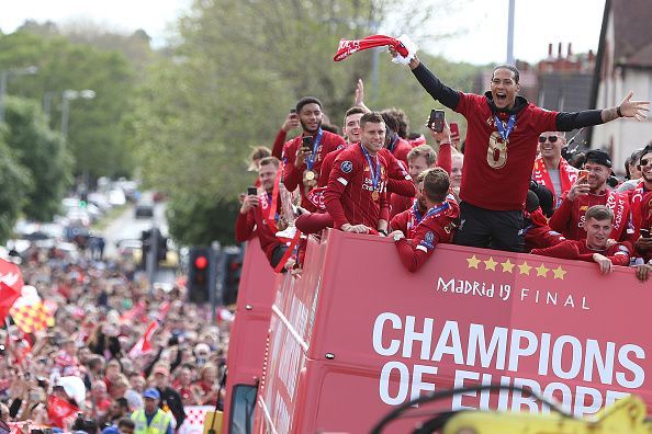 Van Dijk and Origi talk during UEFA Champions League bus parade