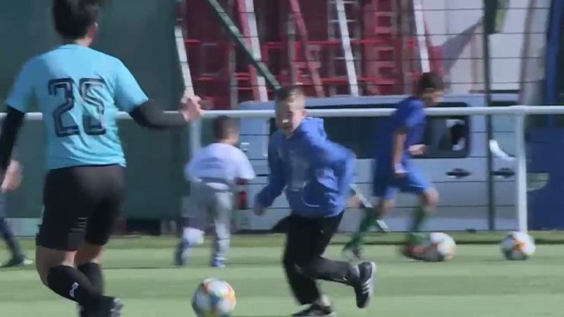 Football Skills: Local child dribbles past Thailand player